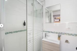 a bathroom with a shower and a sink at Habitaciones IFAE in Alcalá +36 photos