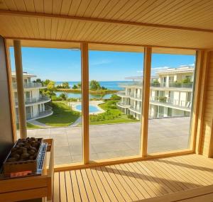 a view from a room with a large window at Waterfront studio in Balatonszemes