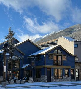 a blue building with a mountain in the background at Hotel Frisco in Frisco