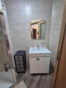 a bathroom with a sink and a mirror at Casa da Mexieira em Ponte da Barca in Ponte da Barca +30 photos