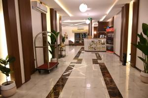 an empty lobby with plants on the floor of a building at فندق امان - أحد رفيدة in Ahad Rafidah