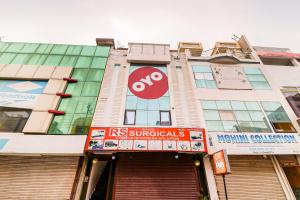 a building with a sign on the front of it at Hotel O by OYO Dhruv Inn in Izatnagar
