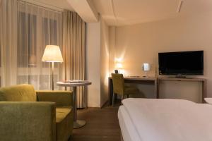 TV o dispositivi per l'intrattenimento presso PLATZHIRSCH ZÜRICH - Downtown Boutique Hotel & Sushi Lounge