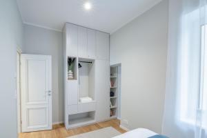 a bedroom with a white cabinet and a door at Luxorious Japandi design apartment in Otepää