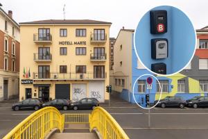 a parking meter in front of a building with cars at BB Naviglio Milano Centro in Milan