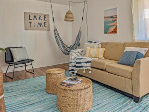 a living room with a couch and two stools at Pet-Friendly Near Zion - Hot Tub Downtown Kanab in Kanab