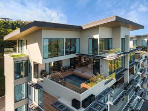 an aerial view of a house with a swimming pool at Oceanview Penthouse - Private Pool - Reserva Conchal in Playa Conchal