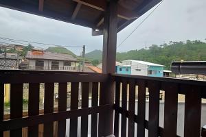 a view from the balcony of a house at Chalé Private c/ Vista e garagem in Ilhabela +6 photos