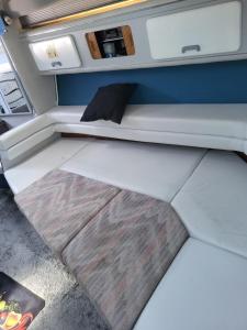 a bed in the back of a camper van at Bateau 66 in Le Barcarès