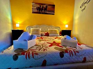 a bedroom with a bed with two laptops on it at Civico 31 in Terralba