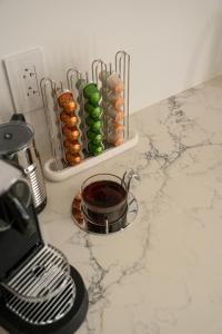 a kitchen counter with a counter top with a pot andools at Manoir Émery in Montreal