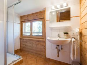 a bathroom with a sink and a shower at Waldberg in Krimml +23 photos