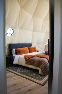 a bedroom with a bed in a tent at Dome on the Range in Duchesne
