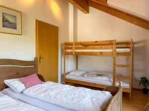 a bedroom with two bunk beds in a room at Kötschach in Kötschach