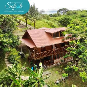 an aerial view of a house in a forest at Casas vacacionales Sofioli in Pedernales