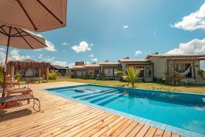 an image of a swimming pool in a house at Falésias Orybá in Corumbau