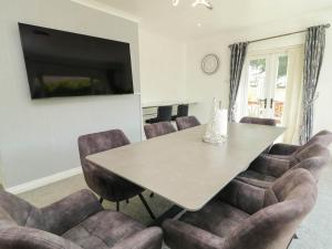 a dining room with a table and chairs at 59 Nursery Avenue in Coleraine