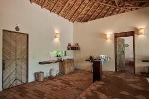 a room with a large room with a door and a table at Casa Macagua in El Puertecito