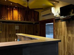 a bar in a kitchen with a counter top at Vijay residency TVR in ThiruvÄrÅ«r