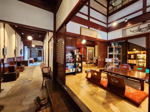 a large living room with a table and chairs at 龍助25 Ryusuke25 in Komatsu