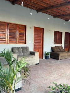 a living room with two couches at Recanto Esmeralda in Fortim