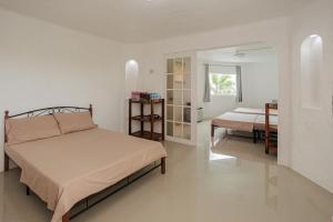 a bedroom with a bed and a mirror at SARDINEBAY Dive Resort in Moalboal +132 photos