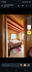 a picture of a bedroom with a bed in a room at Cabaña entre mares Huelmo in Puerto Montt