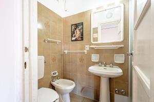 a small bathroom with a toilet and a sink at Artemisia in Varazze +30 photos