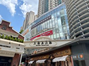 a street with tall buildings in a city at Duplex Garden Villa with Private Courtyard Jing'an Villa Near Metro Downtown Shanghai in Shanghai