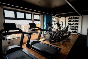 a gym with a bunch of cardio equipment in it at Ceiling INARA 1503 B in Guatemala