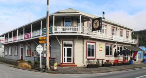 a building on the corner of a street at Hampden Hotel Murchison in Murchison