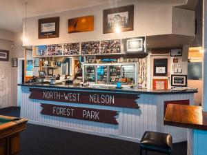 a bar with a sign that reads north west mexican forest park at Hampden Hotel Murchison in Murchison