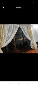 a picture of a tent with curtains in a room at Gigi's transient house in Baguio +1 photo
