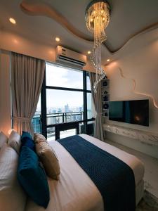 a bedroom with a large bed and a large window at City View at The Gramercy Residences in Makati +87 photos