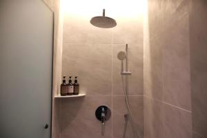 a bathroom with a shower with a glass door at By The Hill in Bukit Mertajam +80 photos