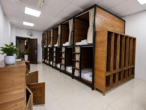 a row of bunk beds in a room at Top of the Loop Hostel Ha Giang in Làng Me