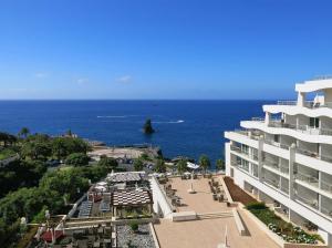 a view of the ocean from a building at Meliá Madeira Mare in Funchal