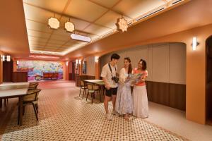 a man and a woman standing in a room at lyf Chinatown Singapore in Singapore +33 photos