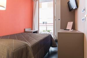 TV a/nebo společenská místnost v ubytování Reginna Palace Hotel
