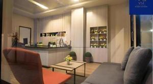 a living room with a couch and a table at V51 Hotel in Ban Hua La Loeng