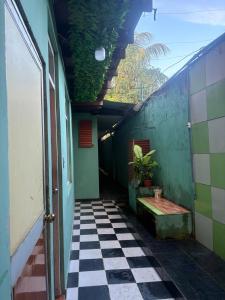 a hallway of a building with a checkered floor at Welcome to the Amazon in Iquitos