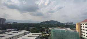 a view of a city with buildings and mountains at Hotel Ipoh City in Ipoh