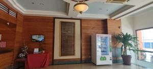 a room with a wooden wall with a refrigerator at Hotel Ipoh City in Ipoh +63 photos