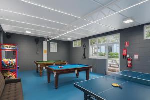 a billiard room with two ping pong tables at Kanasta Caravan Park in Rye +23 photos