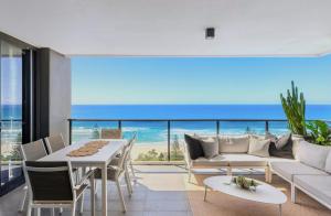 a living room with a view of the ocean at Boardwalk Burleigh Beach - Official in Gold Coast