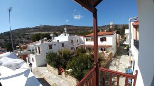 a view of a town from a balcony of a building at Stou Kir Yianni in Omodos