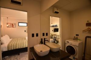 a bathroom with a sink and a washing machine at Simply Stunning Stars B in Lake Tekapo
