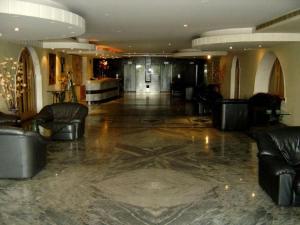 a lobby with leather couches and a star on the floor at Chalet 1BR 1BA with Beach&Pool&Tennis&Basketball in Jounieh