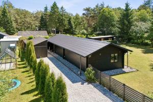 an overhead view of a house with a fence at Luxury Retreat Surrounded By Nature in Rønde