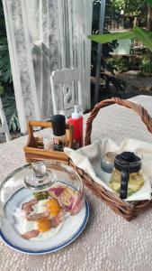 a table with a plate of food and a basket at Slove U House in Khon Kaen +41 photos